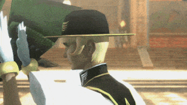 a man wearing a black hat with a gold trim