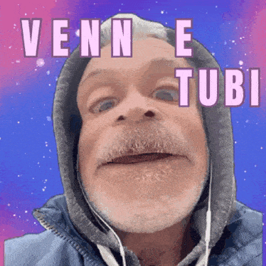 a man with a beard wearing a hooded jacket and ear buds says ' vonne tubi '
