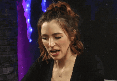 a woman says " having a strategy moment " while looking down