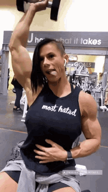 a woman in a black tank top that says most hated