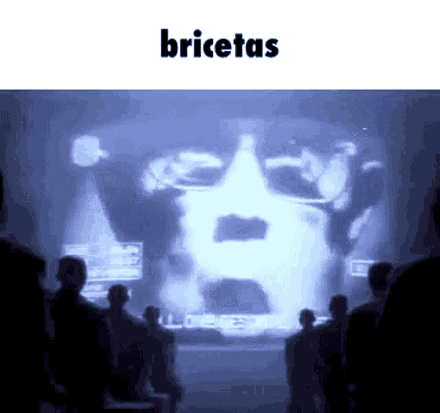 a group of people looking at a screen that says " bricetas "