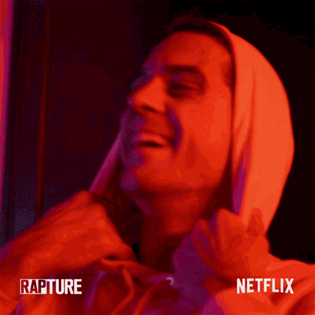 a man wearing a hoodie with rapture and netflix on the bottom