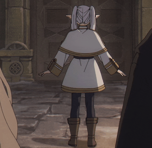 a girl in a white coat and brown boots stands in front of a door