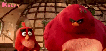 two angry birds are standing next to each other in a room .
