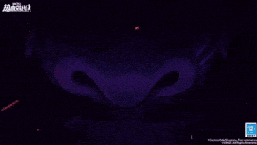 a close up of a monster 's eyes with the number 12 on the bottom left