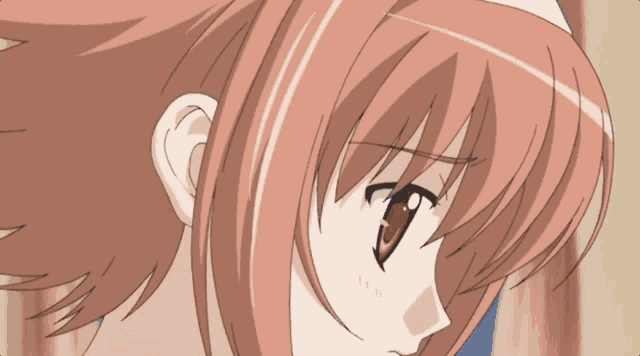 a close up of a girl 's face with pink hair and brown eyes