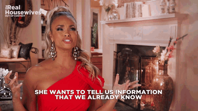 a woman says she wants to tell us information that we already know in front of a fireplace