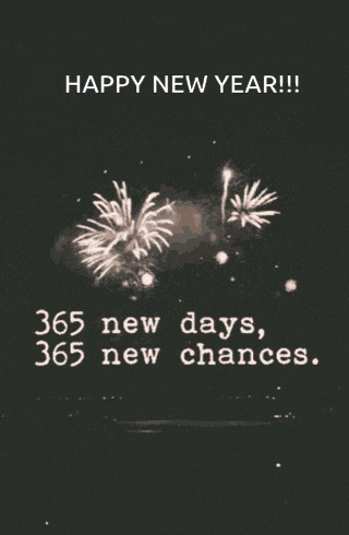 a happy new year greeting with fireworks behind it