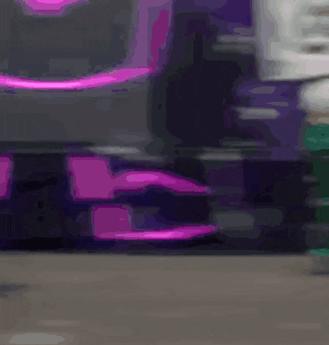 a blurry picture of a purple and black object with a pink stripe on the bottom .