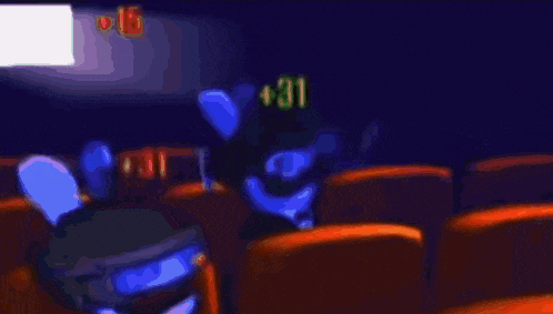 a bunch of stuffed animals are sitting in a theater .