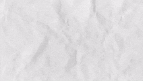a close up of a white crumpled paper texture .
