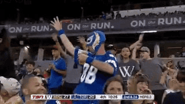 a man in a mask with the number 38 on it