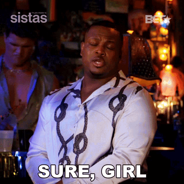 a man in a white shirt says sure girl in a bar
