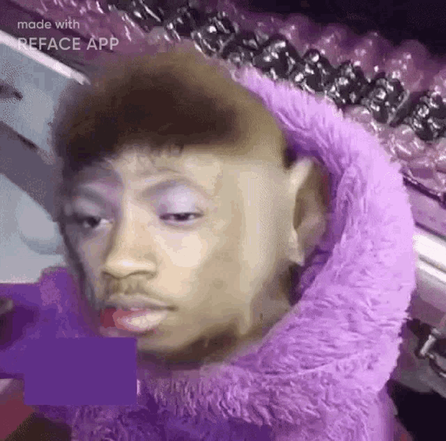 a man is wearing a purple furry sweater and a purple hoodie .