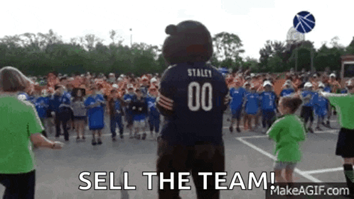 a mascot wearing a number 00 jersey stands in front of a crowd