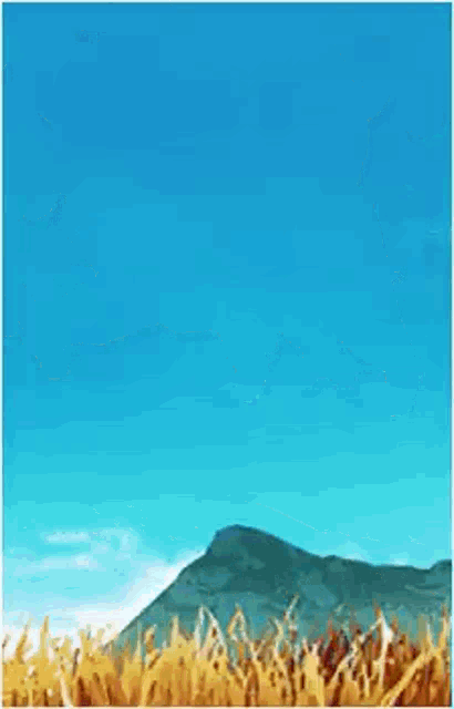 a cartoon of a wolf laying down in a field with mountains in the background .