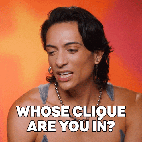a woman says whose clique are you in while wearing a necklace