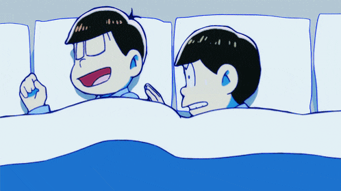 a couple of cartoon characters laying on a bed with a blue blanket