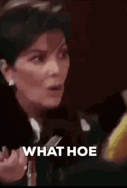 a woman is holding a fork and the words what hoe are on the bottom