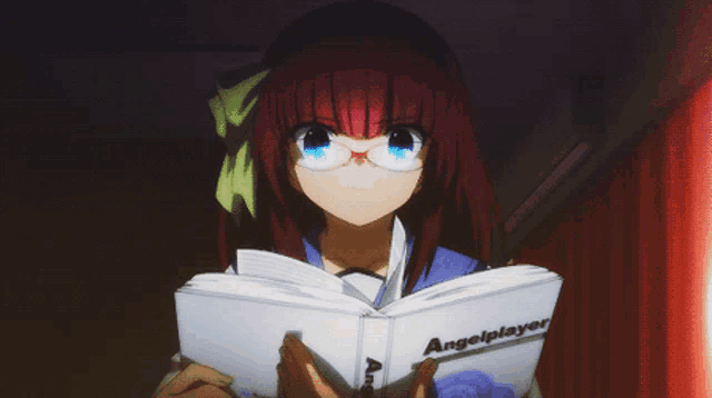 a girl with glasses is reading a book called angelplayer