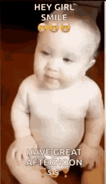 a baby in a diaper is smiling and saying `` hey girl smile '' .