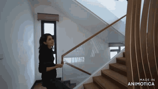 a woman is walking down a set of stairs made in animotica
