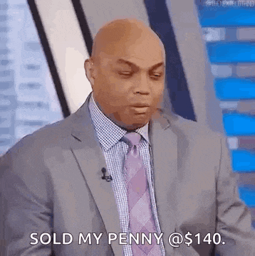 a man in a suit and tie is talking on a television show .