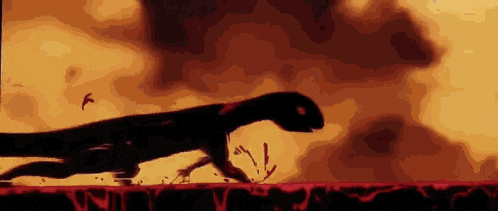 a silhouette of a dinosaur walking on a bloody surface with birds flying in the background .