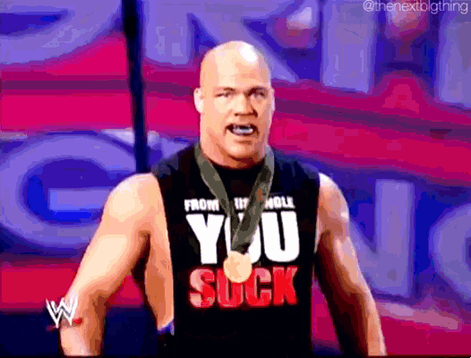 a man wearing a shirt that says " you suck "