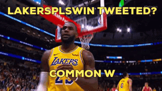 a basketball player in a lakers jersey stands in front of a basketball hoop