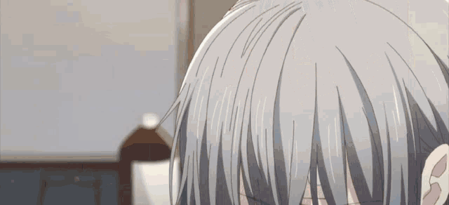 a close up of a person 's hair and ear