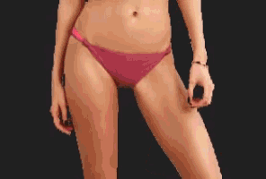 a woman in a pink bikini with a black background