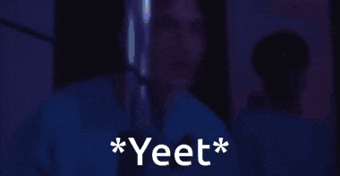 a man in a dark room with the words * yeet * on the bottom
