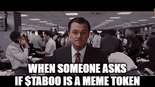 a man in a suit and tie says when someone asks if $ taboo is a meme token in front of a crowd