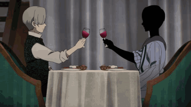 two people are sitting at a table with glasses of wine