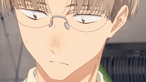 a close up of a person wearing glasses making a funny face