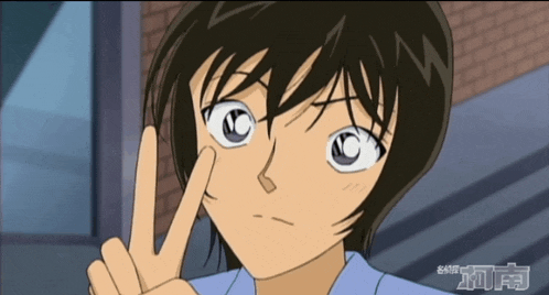 a close up of a person making a peace sign with their finger