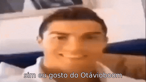 a close up of a man 's face with the words `` sim eu gosto do otavioboom '' written on the bottom .