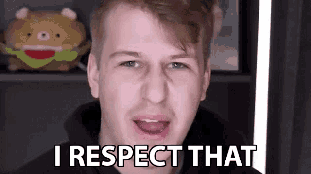 a young man is making a funny face and says `` i respect that '' .