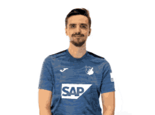 a man wearing a blue shirt that says sap is holding a game controller