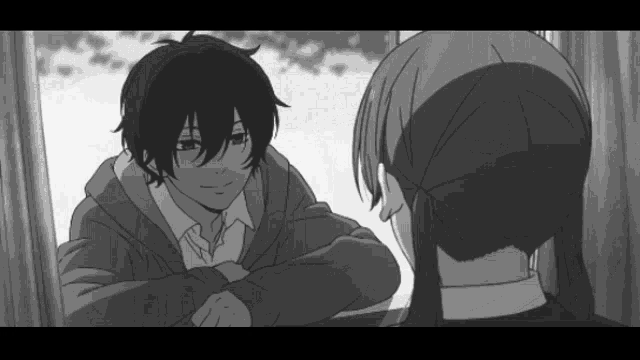 a black and white image of a boy and a girl looking at each other
