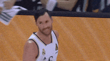 a basketball player wearing a white jersey with the number 5 on it