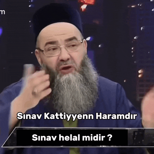 a man with a beard wearing glasses and a hat says ' sinav kattiyyenn haramidr '