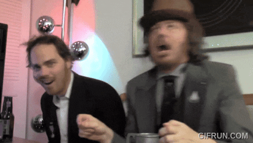 a gif from gifrun.com shows two men dancing
