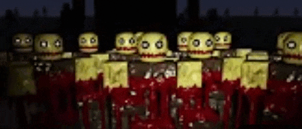a group of zombies are standing next to each other in the dark .