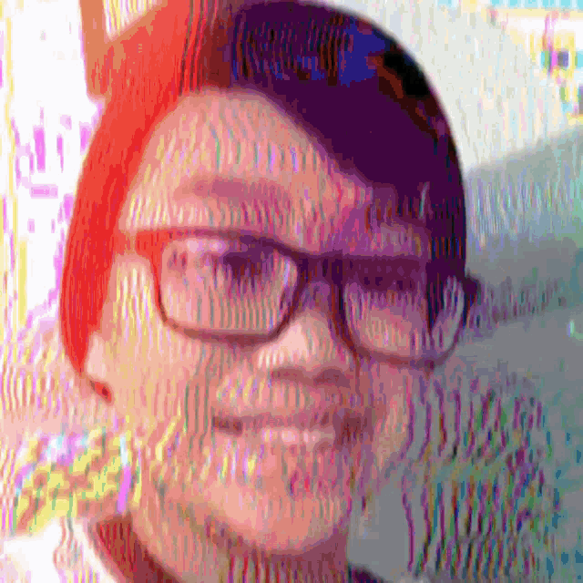 a close up of a person wearing glasses and a hat