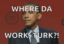 barack obama is wearing a suit and tie and making a funny face while standing in front of a microphone .