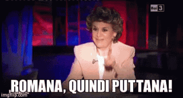 a woman says romana quindi puttana on a television screen