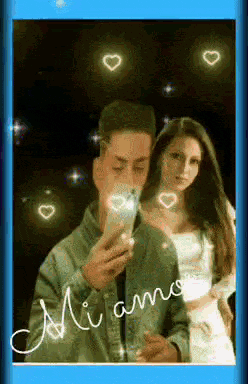 a man is taking a picture of himself and a woman with hearts around them and the words mi amo on the bottom