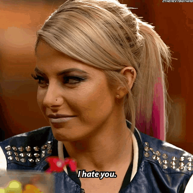 a woman says i hate you while wearing a leather jacket